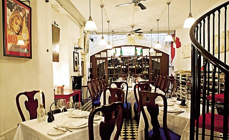 I'm so engrossed in the handsome (and reasonably priced) wine list that I fail to notice a great trolley that appears silently beside our table